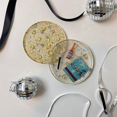 disco ball ornaments are sitting on a table