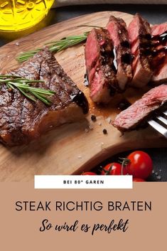 steak with rosemary garnish on a wooden cutting board