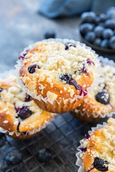 some blueberry muffins are on a cooling rack