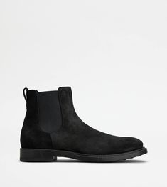 Ankle boots in rich suede with a stamped Tod's monogram, side elastic inserts and a rubber outsole with embossed rubber pebbles. Man Black, Black Ankle Boots, Ankle Boots, Dust Bag, Monogram, Elastic, Boots, Black