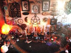 a room filled with lots of assorted items and candles on top of a table