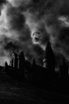 a black and white photo of a castle in the sky with dark clouds above it