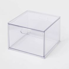 a clear plastic box with a handle on the top and bottom, sitting against a white background