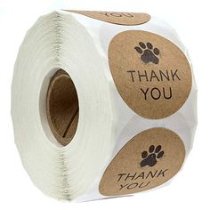 a roll of toilet paper with stickers on it saying thank you and paw prints