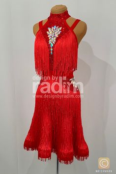 a red dress with fringes and beads on it