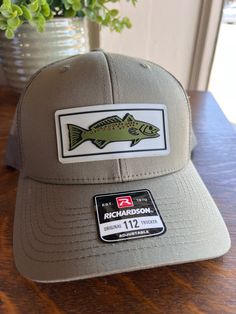 Sea Trout PVC patch on loden green Richardson 112 trucker hat Awesome Father's Day gift!  No customization is available on this item. Casual Trucker Hat For Fishing, Trucker Snapback Hat With Flat Bill For Fishing, Adjustable Trucker Hat For Fishing, Fishing Hats For Men, Brown Snapback Trucker Hat For Fishing, Fishing Trucker Hat, Mens Trucker Hat, Pvc Patches, Fishing Hat