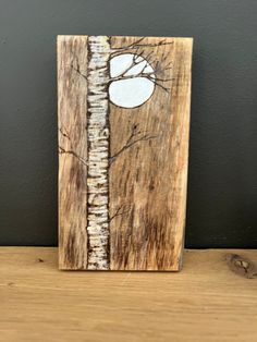 a wooden block with white paint on it