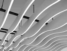 the ceiling is made up of white wavy lines