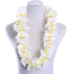 a white and yellow flower necklace on a mannequin