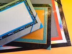 there are many different frames stacked on top of each other, including one with a blank paper in the middle