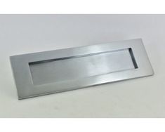 a stainless steel door handle on a white background