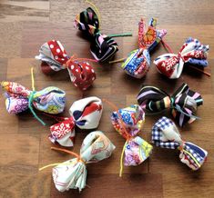 several different types of hair bows on a wooden floor