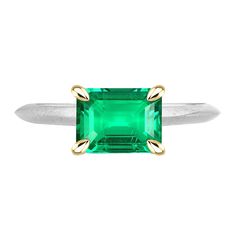 METAL SPECIFICATIONS Two Tone Gold 14K STONE SPECIFICATIONS Stone Name : Green Emerald Stone Cut : Emerald Cut Stone Details : There is one single emerald cut green emerald stone in the center approx. 2 carats (Approx. Size 8 x 6 mm) in the ring. Crafted with a natural earth mined stone. Color : Green Quality : AAA Total : Approx. 2 Carats RING SPECIFICATIONS Size : 6.5 (Can ship in any size) Appraised Value : $7,848.00 Comes with Certificate Classic Green Emerald Ring For Anniversary, Classic Green Emerald Ring With Center Stone, Green Emerald Ring With Round Cut, Classic Green Emerald Ring As Birthstone, Green Emerald Cut Ring With Prong Setting, Green Emerald Jewelry With Center Stone, Emerald Cut Green Emerald Ring For May Birthstone, Green Emerald Ring With Prong Setting, Yellow Gold Emerald Ring With Asscher Cut