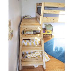 a bunk bed sitting in the corner of a room