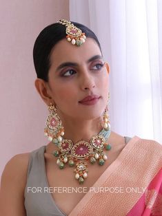 Adorn yourself in timeless elegance with this exquisite mint green and peach Kundan choker necklace set, perfect for weddings and special occasions. Crafted with meticulous attention to detail, the set features delicate mint greeb and peach hues reminiscent of Pakistani and Punjabi traditions, with a touch of Bollywood glamour. Complete with matching earrings and a stunning maangtika, this Indian Kundan ensemble effortlessly captures the essence of sophistication and grace. Measurements:  Weight Pearl Kundan Choker Set, Mint Green Indian Jewellery, Green Kundan Choker Set, Green Kundan Bollywood Choker, Kundan Meenakari Choker, Bollywood Glamour, Kundan Choker Set, Indian Choker Necklace, Elegant White Dress