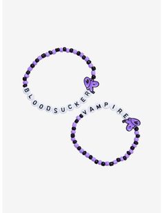 two bracelets with purple and black beads on them, one has a butterfly charm