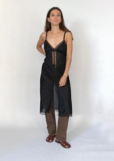 90s Sheer lace slip dress. Features a lace trim to neck, hem and centre, A split at the front which makes it perfect to wear over trousers! Size XS/S - Bust Circ 82cm / Length 106cm Sourced in Japan. No label, fabric is sheer with a tonal stripe design V-neck Slip Dress With Contrast Lace For Spring, Midi Length Slip Dress With Lace Trim For Daywear, Black Lace Trim Midi Slip Dress, Fitted V-neck Slip Dress With Contrast Lace, Fitted Lace Patchwork Slip Dress For Daywear, Black Midi Slip Dress With Lace Trim, Fitted Lace Slip Dress For Daywear, Black Lace Slip Dress With Bias Cut, Black Lace Bias Cut Slip Dress