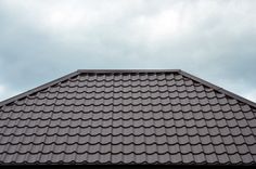 the roof of a building with a sky background