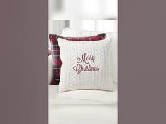 a white pillow with merry christmas written on it