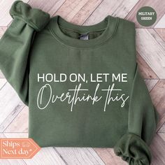 All of our Hold On Let Me Overthink This hoodies are handmade to order on an ultra soft crewneck that will quickly become your go to apparel item! You will never want to take it off! Our Sarcastic sweatshirts are handmade to order with eco-friendly water based ink that feels good and lasts longer! ♥The details♥ This unisex sweatshirt is crafted from soft, breathable fabric for ultimate comfort. Printed with an eco-friendly water-based ink, this sweater not only looks great but also supports sustainable practices. The unisex sizing allows for a versatile fit, but we suggest sizing up for a more relaxed look. To keep your crewneck looking its best, we recommend washing it on cold and either hanging it to dry or tumble drying it on low heat. Be sure to avoid ironing directly on the design to Cute Sweaters With Sayings, Sarcastic Sweatshirts, Sweater Sayings, Funny Sweater, Cheer Ideas, Nerdy Shirts, Cricket Ideas, Sweater Ideas, Circuit Ideas