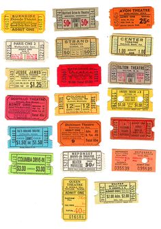 several different colored tickets sitting on top of each other