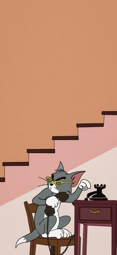 a cartoon cat sitting at a desk in front of a stair case next to a phone