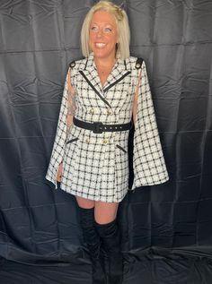 She's truly one of a kind--timeless, classy, and stunning. This is a fabulous quality style to last a lifetime. Super high quality, black, white, and gold plaid, tweed material. Fully lined. Stunning cape style long sleeves take this dress to another level. Shoulder pads, ornate shoulder detail, and edgy collar give this dress a timeless cape silhoette, making her a real standout. Double breasted front closure with statement gold buttons. Black belt included. True to size with no stretch in the Long Sleeve Tweed Dress For Fall Party, Long Sleeve Tweed Party Dress For Fall, Fall Party Long Sleeve Tweed Dress, White Long Sleeve Tweed Dress For Fall, Long Sleeve Tweed Dress For Fall Evenings, Long Sleeve Tweed Dress For Evening In Fall, Elegant Plaid Tweed Dress For Formal Occasions, Evening Long Sleeve Tweed Dress For Fall, White Tweed Dress For Fall