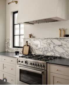 a stove top oven sitting inside of a kitchen