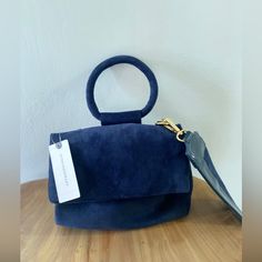 Brand New With Tags Can Transform From Crossbody To A Handy Clutch. Small But So Much Room Inside The Bag. Suede Navy Blue Never Worn! Here Are More Pics Inside Never Has It Been Used! Gorgeous For Fall Colors! Blue Shoulder Bag With Round Handle For Evening, Blue Shoulder Bag With Top Round Handle, Blue Shoulder Bag With Round Handle, Blue Bags With Top Carry Round Handle, Blue Double Handle Shoulder Bag For Party, Blue Shoulder Bag With Detachable Strap And Round Handle, Blue Party Shoulder Bag With Double Handle, Versatile Blue Top Handle Satchel, Blue Crossbody Evening Bag With Detachable Handle