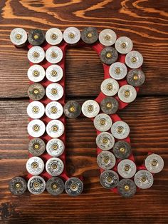 Made to order 8” wooden shotgun shell letter. Letter and background color can be customized. Shell color options are brass, nickle, or a combination of both Shotgun Shell Gifts For Him, Shotgun Shell Art, Shell Casings Crafts, Bullet Casing Crafts, Shotgun Shell Jewelry, Shotgun Shell Crafts, Bullet Crafts, Hunting Room, Bullet Shell