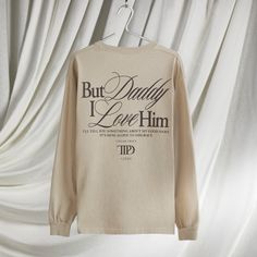 a long - sleeved t - shirt that says, but daddy i love him