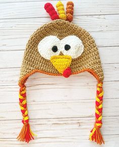 a crocheted hat with a turkey face on it