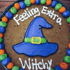 a birthday cake with the words feeling extra witch on it