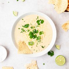 a bowl of quesadilla soup with tortilla chips on the side