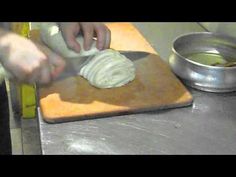 a person is cutting onions on a cutting board