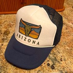 Vintage Trucker Hat From Arizona. Never Worn Retro White Hat For Rodeo, White Retro Hats For Vacation, White Retro Hat For Vacation, Casual Blue Hats For Rodeo, Casual White Hats For Rodeo, White Western Style Snapback Hat, White Retro Vacation Hat, White Western Snapback Hat, Blue Adjustable Trucker Hat For Rodeo