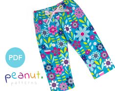 a pair of blue pants with flowers on them and the words, peanut patterns