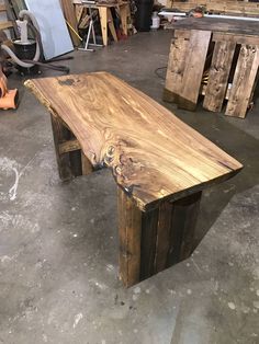 a table made out of wood sitting in a garage