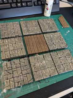 some brownies are on a cutting board next to a keyboard