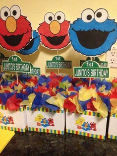 sesame street birthday party favors with elmo's birthday toppers and tissue bags