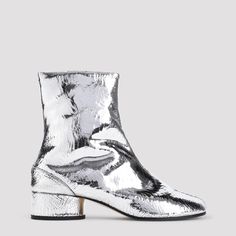 Maison Margiela Tabi H30 Silver Calf Leather Ankle Boots. Crafted with silver and crinkle calf leather, iconic Tabi toe, zipper closure, ankle length, block heel, leather lining and outsole. Tabi Boots, Maison Margiela Tabi, Margiela Tabi, Margiela Shoes, Ankle Boots For Women, Golden Goose Shoes, Leather Cap, Boots For Women, Designer Boots