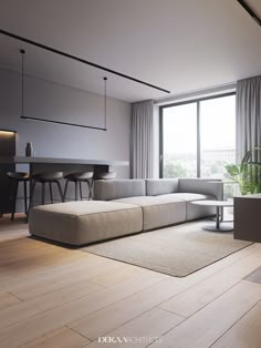 a living room filled with furniture next to a large window and a table in front of it