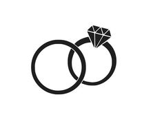 two wedding rings with a diamond on the top and one in the middle, against a white background