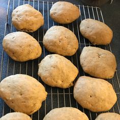 several loaves of bread sitting on a cooling rack