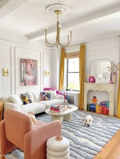 a living room filled with furniture and a dog laying on the floor next to it