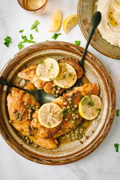 chicken with lemons and capers in a bowl