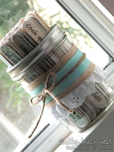 mason jar filled with money sitting on top of a window sill