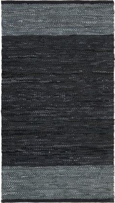 a black and grey rug with horizontal stripes