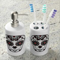 two toothbrush holders with toothpaste in them