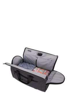 an open suitcase with its lid opened and clothes in the bottom compartment, on a white background